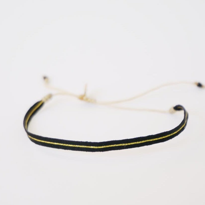 Pulsera negra/dorado