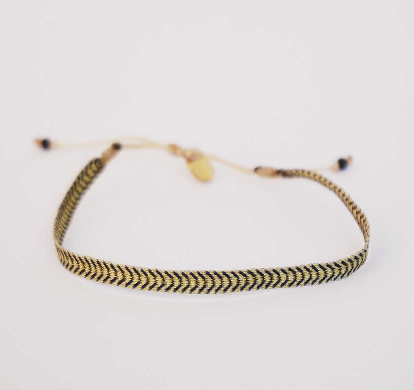 Pulsera negra/dorado