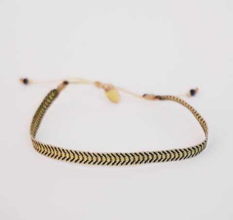 Pulsera negra/dorado